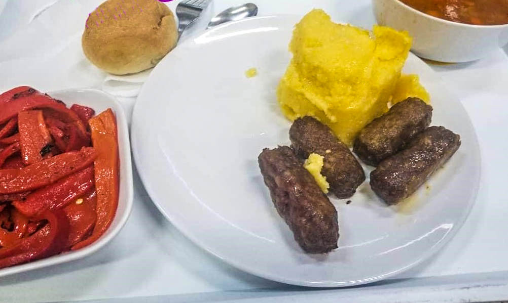 Enjoying delicious and inexpensive Romanian food at an autoservire restaurant.