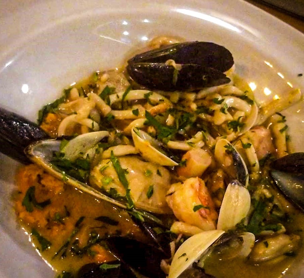 Enjoying seafood pasta at Pizzico in Constanța.