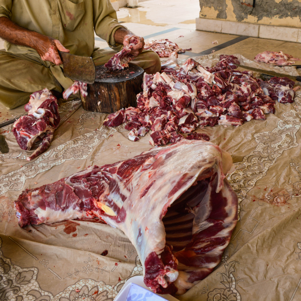 Celebrating Eid Al-Adha In Pakistan: My Eye-Opening Experience 7 Cutting mutton after qurbani.