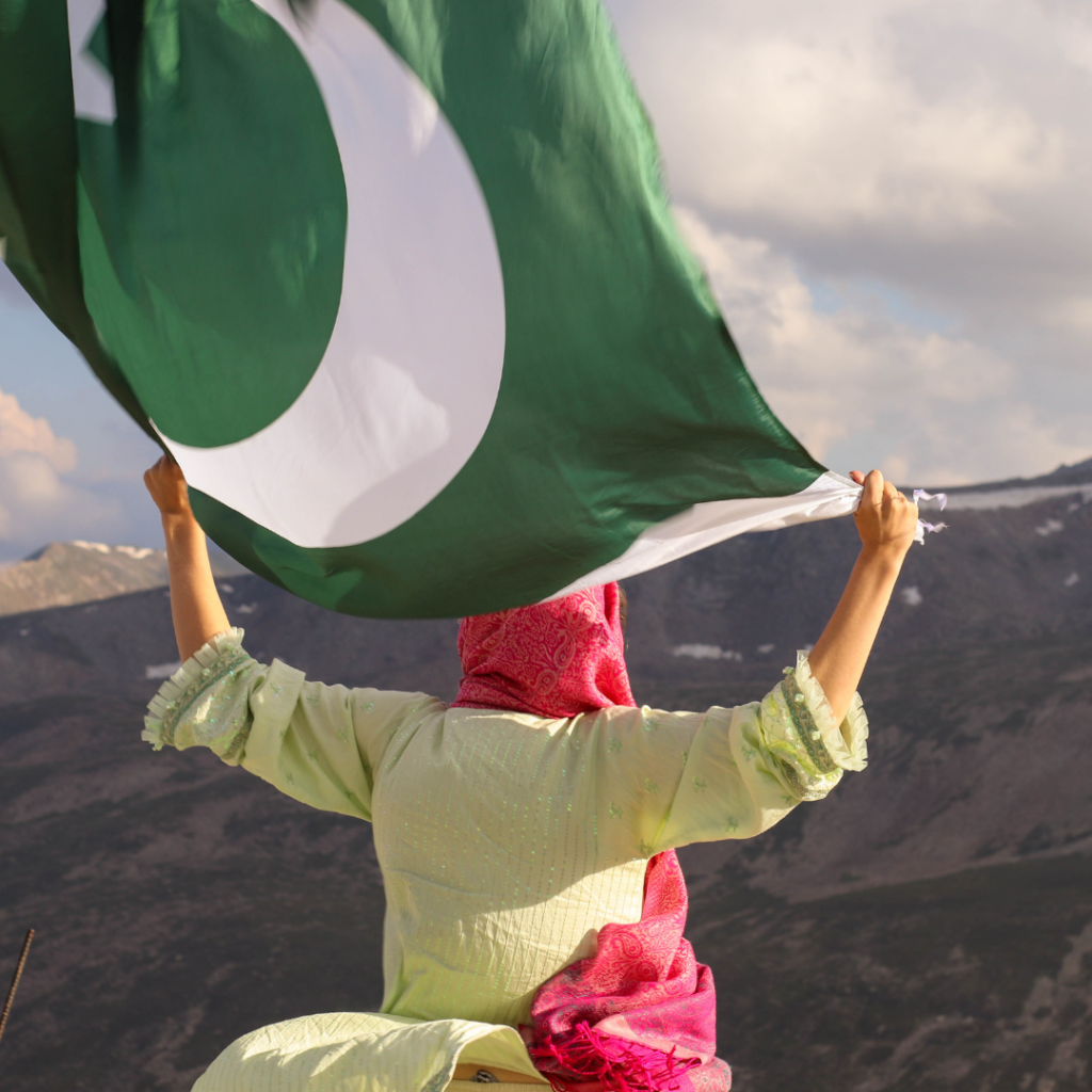 Waving a Pakistan flag on top of Babusar Top Mountain, Chilas.