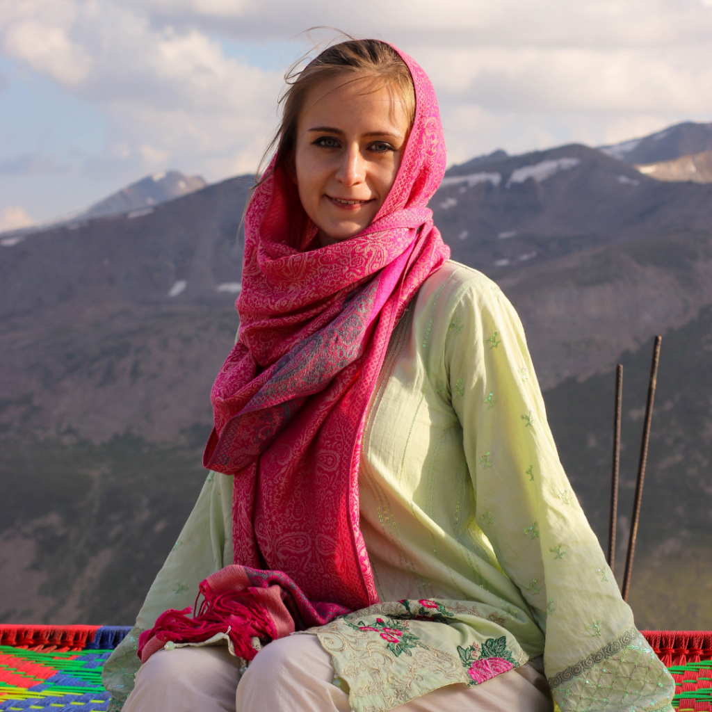 Stuck On The World's Most Dangerous Road: Pakistan Travel Stories 6 Enjoying a relaxing afternoon at Babusar Top, Pakistan, with an incredible view of the area around Naran.