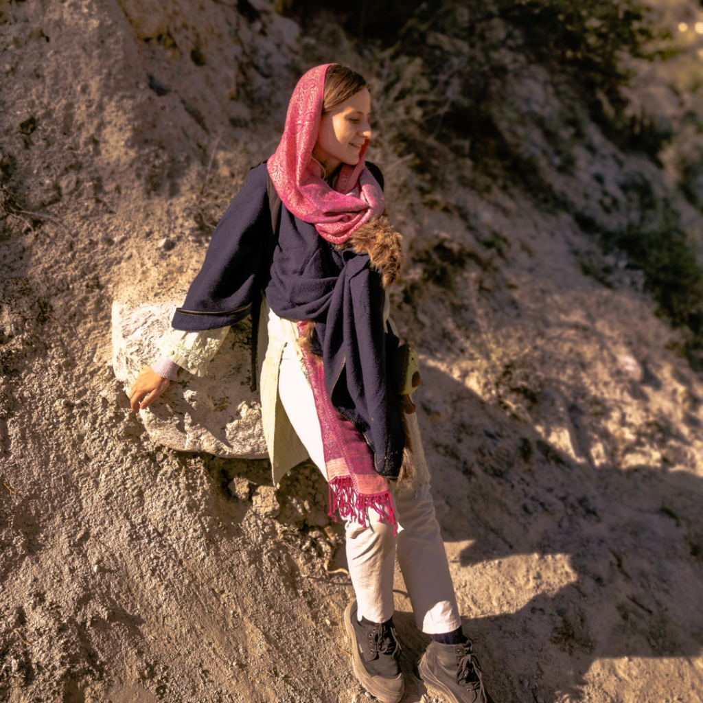 Fairy Meadows And Nanga Parbat Basecamp Trek - Everything You Need To Know 17 Girl resting on a rock during the trek to Fairy Meadows, Pakistan.
