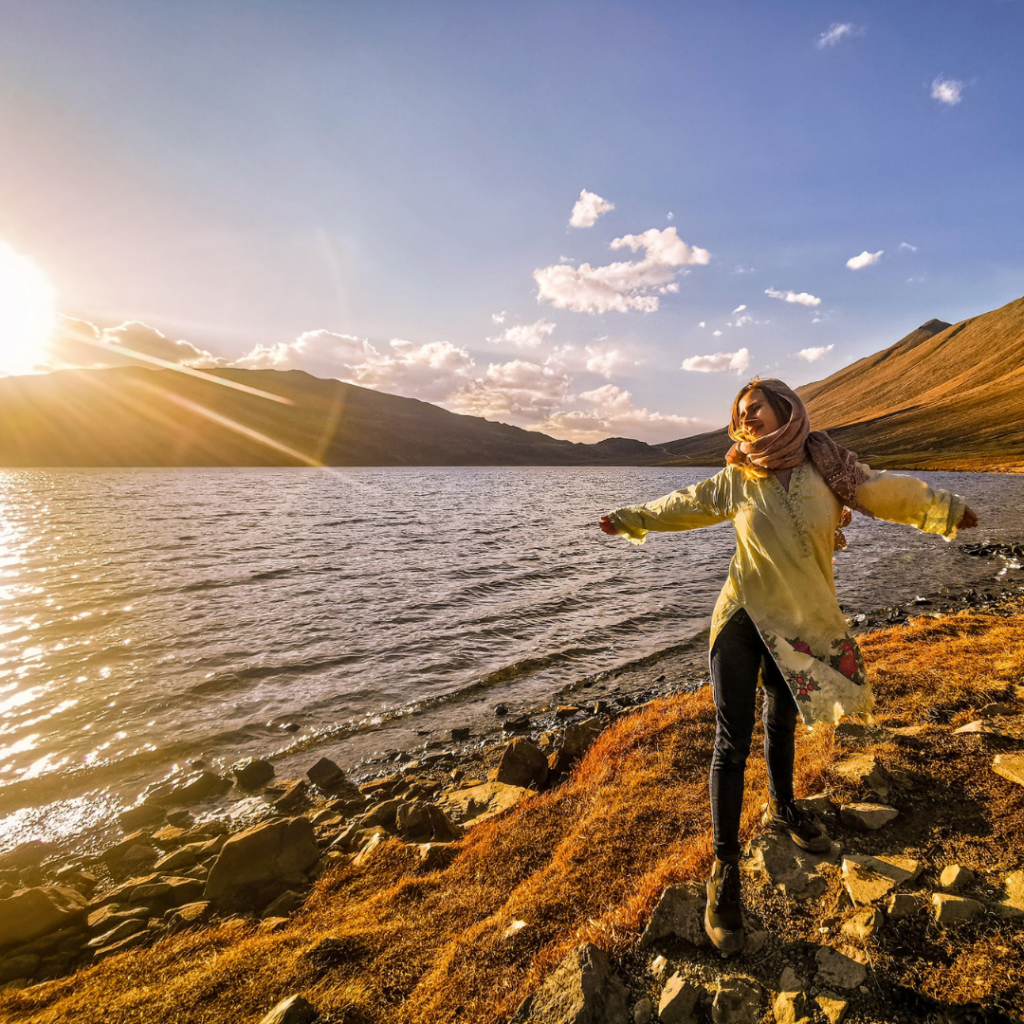 A Complete Travel Guide To Skardu, Pakistan 6 Girl enjoying the sun at Deosai National Park in October.