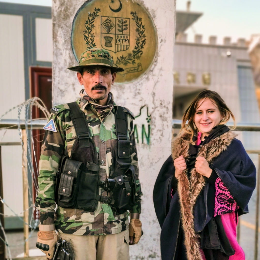 Warm Encounters At The Icy Border: Visiting Khunjerab Pass From Hunza Valley 12 Foreign girl posing with a Pakistani border guard at the Pakistan-China border at Khunjerab Pass.