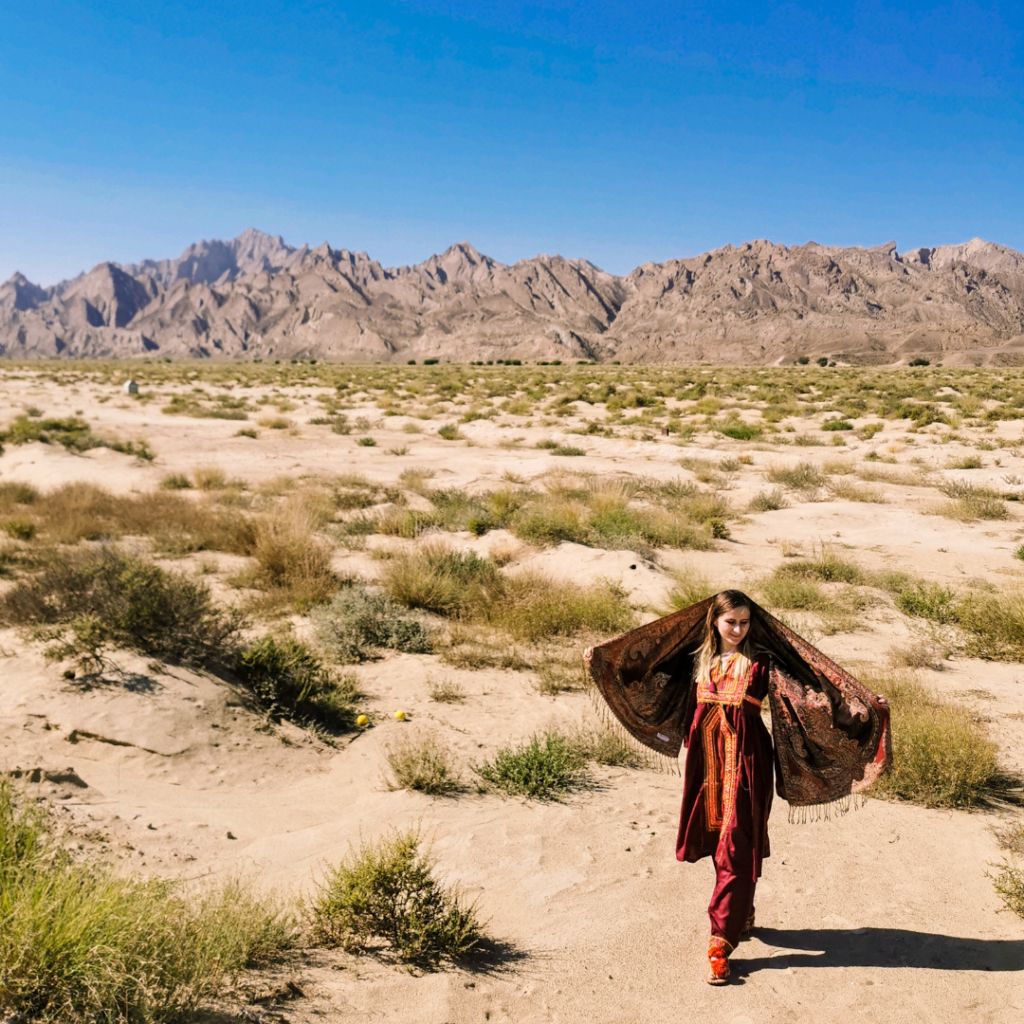Full Itinerary For An Incredible Balochistan Day Trip From Karachi 16 Foreign girl in traditional Balochi dress in the desert of Balochistan, Pakistan.