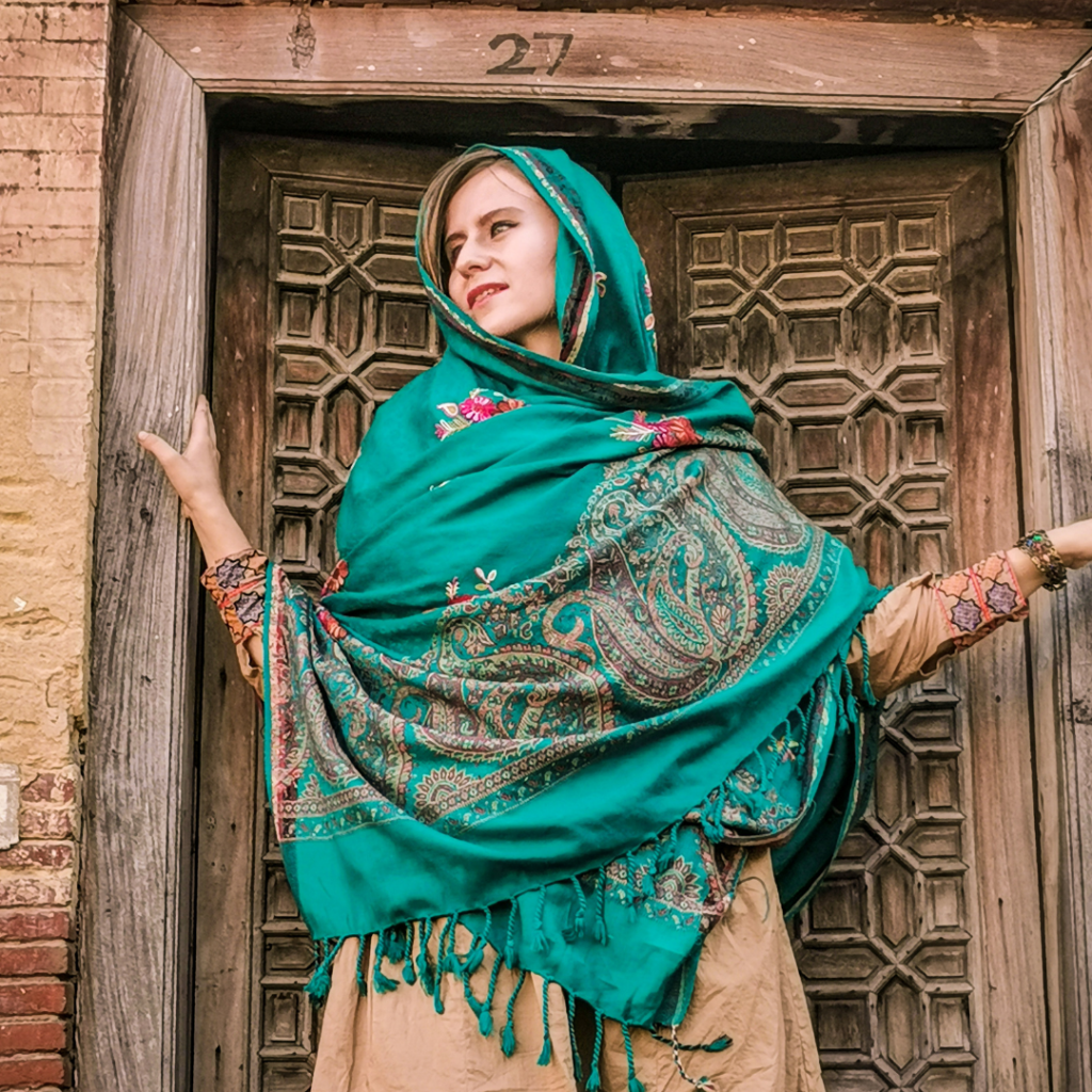 Foreign girl in traditional blue dupatta in Lahore, Pakistan.