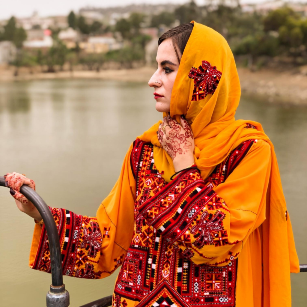 My Astonishing Visit To The Tribal Areas of Punjab, Pakistan 8 Girl in yellow traditional Balochi dress.
