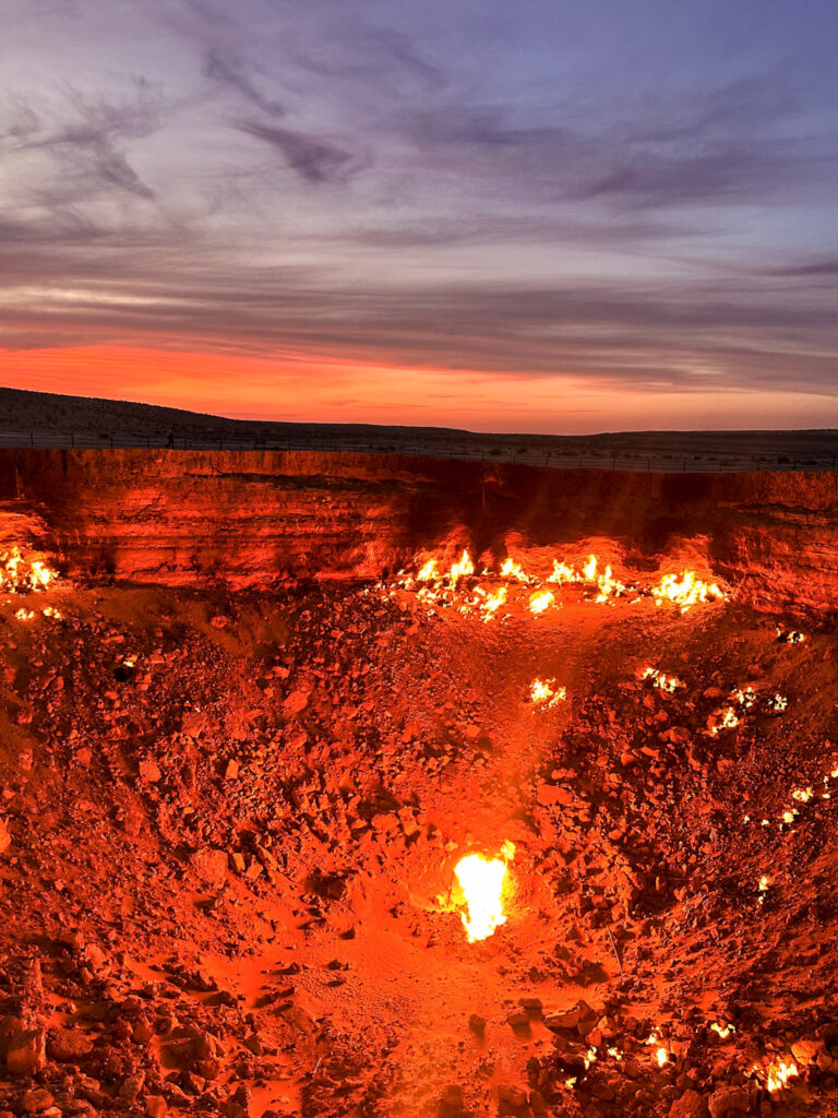 Sunset over the burning gas crater Derweze, Gate to Hell, Turkmenistan