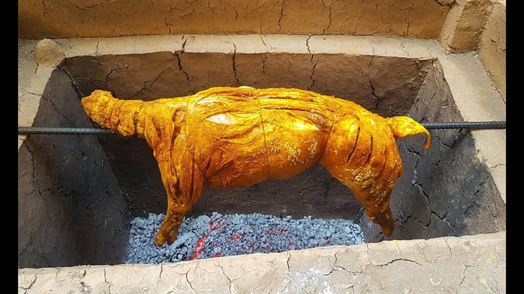 Secret Balochistan - 10 Days Tour To One Of The LEAST VISITED PLACES ON EARTH 13 A whole goat being grilled as rotisserie over hot coals (Kadi kebab), in Quetta, Balochistan, Pakistan