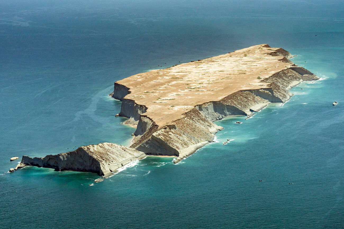 Secret Balochistan - 10 Days Tour To One Of The LEAST VISITED PLACES ON EARTH 7 Aerial view of Astola Island, Balochistan, Pakistan, an uninhabited island surrounded by blue sea.